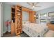 Cozy bedroom featuring a built-in murphy bed with shelving and serene water views at 571 Port Bendres Dr, Punta Gorda, FL 33950