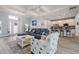 Bright and airy living space with modern decor, seamless flow to kitchen, and tray ceilings at 571 Port Bendres Dr, Punta Gorda, FL 33950
