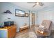 Relaxing den/office boasts modern decor, comfortable seating, and ample storage space at 571 Port Bendres Dr, Punta Gorda, FL 33950