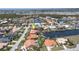 Aerial view of a beautiful waterfront neighborhood featuring private boat docks and lush landscaping at 584 Toulouse Dr, Punta Gorda, FL 33950