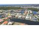 Overhead image of a charming waterfront community featuring canals, boat docks, and well-maintained properties at 584 Toulouse Dr, Punta Gorda, FL 33950