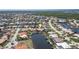 Captivating aerial view showcasing stunning waterfront homes with private docks and serene canal access at 584 Toulouse Dr, Punta Gorda, FL 33950