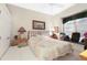Cozy bedroom with a double bed, window seat, and closet with sliding doors, offering a relaxing space at 584 Toulouse Dr, Punta Gorda, FL 33950
