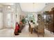 Bright dining room showcasing tile floors, chandelier, ample natural light, and elegant furnishings at 584 Toulouse Dr, Punta Gorda, FL 33950