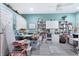 Spacious hobby room with lots of storage space, shelves, and a ceiling fan at 584 Toulouse Dr, Punta Gorda, FL 33950