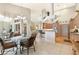 Open kitchen and dining area featuring tile flooring, natural light, and access to additional living spaces at 584 Toulouse Dr, Punta Gorda, FL 33950