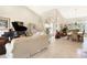 Expansive living room showcasing tile floors, high ceilings, a grand piano, and stylish furnishings at 584 Toulouse Dr, Punta Gorda, FL 33950