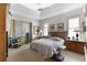 Tranquil main bedroom with neutral walls, tray ceiling, carpet and large windows providing natural light at 584 Toulouse Dr, Punta Gorda, FL 33950