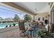 Covered patio features comfortable seating with nice views of the pool and waterway at 584 Toulouse Dr, Punta Gorda, FL 33950