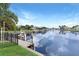 Stunning views of the intercoastal waterway with lush landscaping and boat dock at 584 Toulouse Dr, Punta Gorda, FL 33950