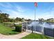 Scenic canal view with boat docks, green landscaping, and calm water at 584 Toulouse Dr, Punta Gorda, FL 33950