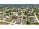 Lovely aerial view of a home in a residential area featuring lush greenery and well-kept properties at 6344 Hera St, Englewood, FL 34224