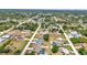 Overhead shot of a residential area with well-spaced homes, green foliage, and a sense of community at 6344 Hera St, Englewood, FL 34224