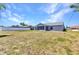 Spacious backyard featuring a white fence and covered patio at 6344 Hera St, Englewood, FL 34224