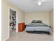 A spacious bedroom with a bed and en suite bathroom at 6344 Hera St, Englewood, FL 34224
