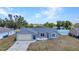 Charming single-story home featuring a neutral color scheme, an attached garage, and a well-maintained lawn at 6344 Hera St, Englewood, FL 34224