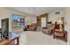 Cozy living room featuring tile flooring, neutral-toned walls, and comfortable seating, creating a relaxing ambiance at 6344 Hera St, Englewood, FL 34224