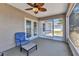 Enclosed patio with comfortable seating and a view of the backyard at 6344 Hera St, Englewood, FL 34224