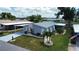 An elevated view displays a home with car port, beautiful landscaping and exterior design at 749 Watersedge St, Englewood, FL 34223