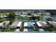 A waterfront home with lush landscaping and community lake views in a peaceful 55+ neighborhood at 749 Watersedge St, Englewood, FL 34223