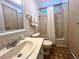 Bathroom features a vanity with a sink and a tub/shower combination with neutral accents at 749 Watersedge St, Englewood, FL 34223