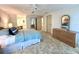 Bright and airy bedroom with neutral tones and a comfortable bed, with adjacent bathroom at 749 Watersedge St, Englewood, FL 34223