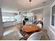 Dining area adjacent to kitchen and living room, promoting easy flow and conversation at 749 Watersedge St, Englewood, FL 34223