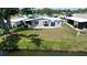 Charming single-story home boasts well-maintained lawn, bay window, and picturesque water view at 749 Watersedge St, Englewood, FL 34223