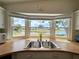 Kitchen sink in front of a window overlooking a serene waterfront view at 749 Watersedge St, Englewood, FL 34223