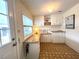 The light and bright laundry room features counter and storage space at 749 Watersedge St, Englewood, FL 34223