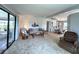 Cozy living room with comfortable seating and sliding doors to the sunroom at 749 Watersedge St, Englewood, FL 34223