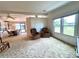 Open-concept living area with dining space and comfortable seating, providing versatile living and entertaining options at 749 Watersedge St, Englewood, FL 34223
