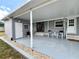 The patio is complete with furniture, offering relaxation and outdoor enjoyment at 749 Watersedge St, Englewood, FL 34223