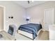 Well-lit bedroom featuring modern decor and neutral color palette at 8968 Artisan Way, Sarasota, FL 34240