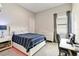 Comfortable bedroom with a dedicated workspace and ambient lighting at 8968 Artisan Way, Sarasota, FL 34240
