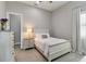 Cozy bedroom with a single bed, white furniture, and neutral colors at 8968 Artisan Way, Sarasota, FL 34240