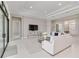 Bright living room with modern decor and a large sliding glass door at 8968 Artisan Way, Sarasota, FL 34240