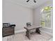 An office space features an executive desk, an office chair, natural light, and a neutral color scheme at 8968 Artisan Way, Sarasota, FL 34240