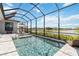 Refreshing swimming pool with views of the tranquil backyard and waterfront at 8968 Artisan Way, Sarasota, FL 34240
