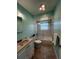 Bathroom with a shower and tub combination, a ceramic sink, and well-maintained fixtures at 931 Juno Dr, Punta Gorda, FL 33950
