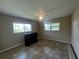 Bedroom featuring tile floors, natural light, and neutral walls for a serene living space at 931 Juno Dr, Punta Gorda, FL 33950