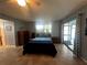 Cozy bedroom with a large window, closet, and neutral walls for a serene living space at 931 Juno Dr, Punta Gorda, FL 33950