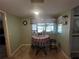 Bright breakfast nook with colorful table setting, natural light, and cozy ambiance for enjoying meals at 931 Juno Dr, Punta Gorda, FL 33950