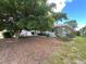 Charming single-story home with well-kept landscaping and mature shade tree at 931 Juno Dr, Punta Gorda, FL 33950