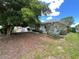 Charming single-story home with well-kept landscaping and mature shade tree at 931 Juno Dr, Punta Gorda, FL 33950
