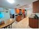 Well-lit kitchen featuring stainless steel appliances, granite countertops, and ample cabinet space at 931 Juno Dr, Punta Gorda, FL 33950