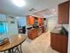 Charming kitchen featuring granite countertops, stainless steel appliances, and warm wood cabinetry at 931 Juno Dr, Punta Gorda, FL 33950