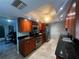 Updated kitchen with stainless steel appliances, granite counters, and ample cabinet space at 931 Juno Dr, Punta Gorda, FL 33950