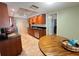 Cozy kitchen featuring wooden cabinetry, stainless appliances, and a breakfast nook at 931 Juno Dr, Punta Gorda, FL 33950