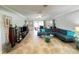 Well-lit living room showcasing tile flooring, recessed lighting, and neutral paint colors at 931 Juno Dr, Punta Gorda, FL 33950